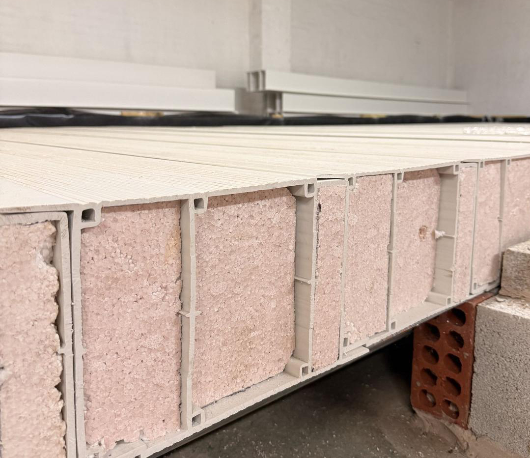 Cross section of Polibeam showing beam profile and EPS insulation, installed on masonry